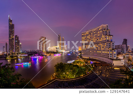 Chao Phraya River under sunset sky, twilight, view from top of Bangkok building. 129147641
