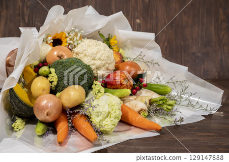 A bunch of flowers include with vegetable, onion, carrot, apple, pumpkin, cabbage. 129147888