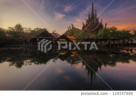 Sanctuary of Truth temple construction on sunrise in Pattaya, Thailand. The sanctuary is an all-wood building filled with sculptures based on traditional Buddhist and Hindu motifs. 129147889