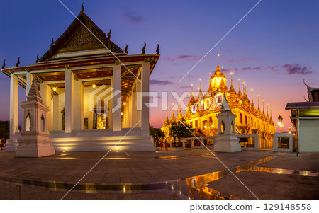 Beautiful sky and Wat Ratchanatdaram Temple in Bangkok, Thailand. Thai architecture: Wat Ratchanadda, Loha Prasat and Traditional Thai pavilion is among the best of Thailand's landmarks. Beautiful sky and Wat Ratchanatdaram Temple in Bangkok, Thailand. Thai architecture: Wat Ratchanadda, Loha Prasat and Traditional Thai pavilion is among the best of Thailand's landmarks. 129148558