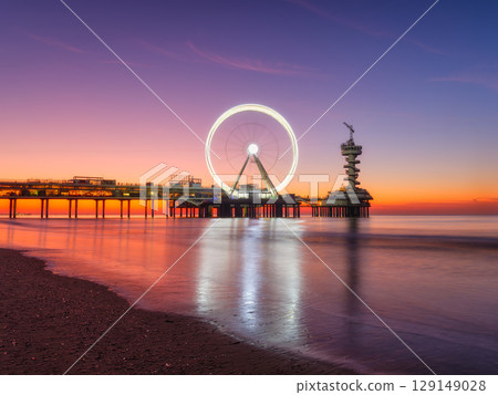 The Hague, Netherlands. Sea pier and Ferris wheel. Famous place on the beach in Holland. The Hague, Netherlands. Sea pier and Ferris wheel. Famous place on the beach in Holland. 129149028