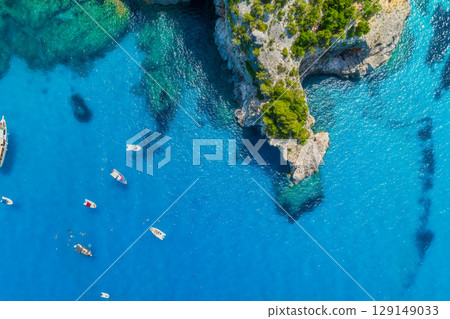 Sardinia, Italy. Drone view of the sea coast. Rocky shore and sea water. Vacation and travel. Sardinia, Italy. Drone view of the sea coast. Rocky shore and sea water. Vacation and travel. 129149033