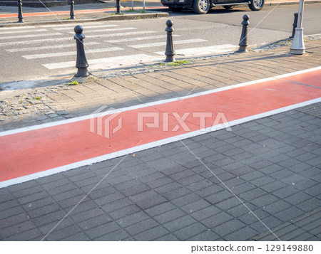 Bike path in the city. Part of the bike path. Convenience for cyclists in a modern city. Infrastructure. Bike path in the city. Part of the bike path. Convenience for cyclists in a modern city. Infrastructure. 129149880