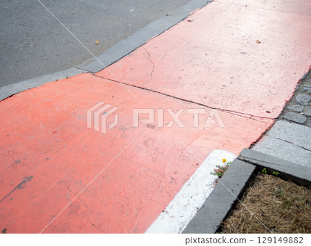 Bike path in the city. Part of the bike path. Convenience for cyclists in a modern city. Potholes. Red highlighted area. Bike path in the city. Part of the bike path. Convenience for cyclists in a modern city. Potholes. Red highlighted area. 129149882