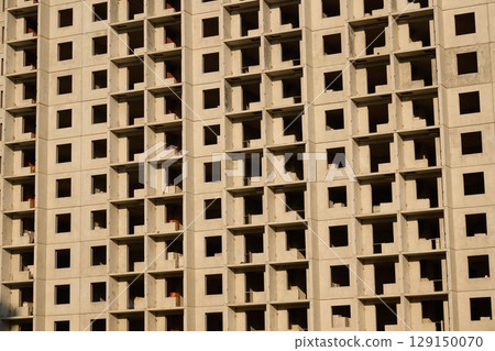 Abstract Patterns Found on the Facade of a Contemporary Concrete Building Design 129150070