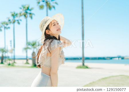 Young woman beach resort image Young woman beach resort image 129150077