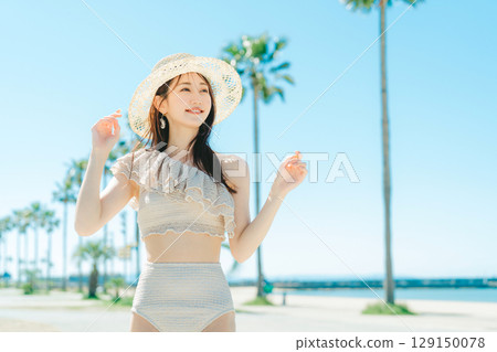 Young woman beach resort image 129150078
