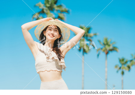 Young woman beach resort image 129150080