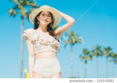 Young woman beach resort image Young woman beach resort image 129150081