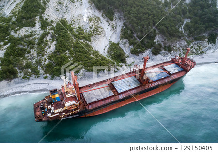 Aerial view of an abandoned bulk-carrier dry cargo ship washed ashore after a storm 129150405