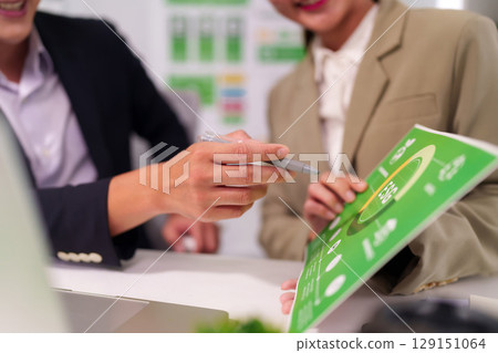 Business professionals analyze environmental social governance strategy during a meeting to foster sustainable corporate development 129151064