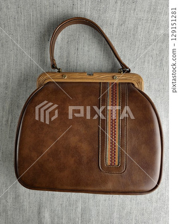 Leather evening bag made in Yugoslavia. Vintage 1970s. Brown leather is combined with an insert of an ornament on the surface. 129151281