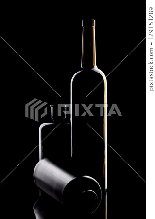 Still life with glass objects on a black background Still life with glass objects on a black background 129151289