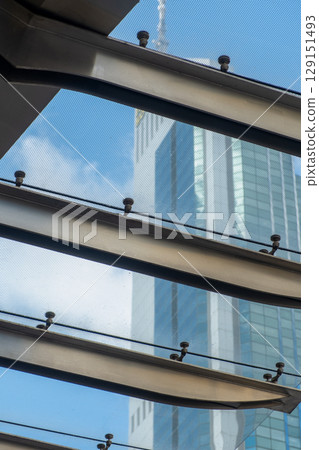 Detail of skylight structure with high rise building in the background 129151493