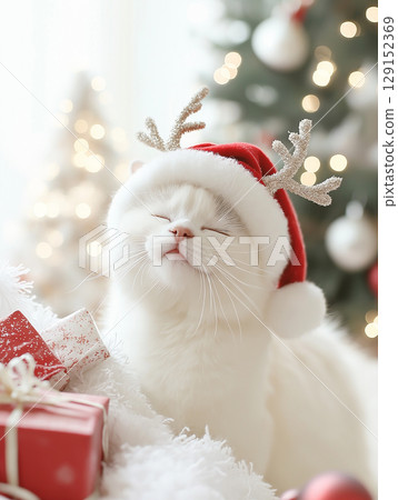 Cute cat with antlers enjoying festive Christmas holiday in winter scene Cute cat with antlers enjoying festive Christmas holiday in winter scene 129152369