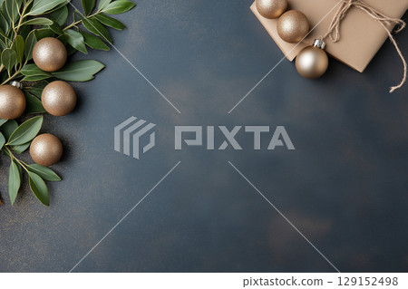 Holiday decor with christmas gift and ornaments on elegant festive background 129152498