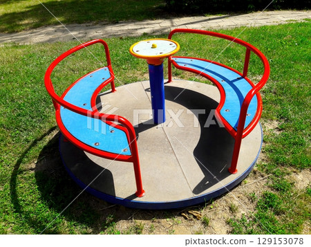 A Colorful and Engaging Playground MerryGoRound Designed Specifically for Kids to Enjoy A Colorful and Engaging Playground MerryGoRound Designed Specifically for Kids to Enjoy 129153078