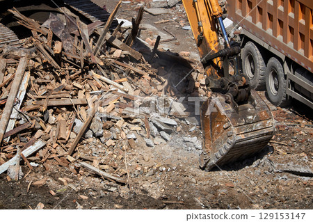 excavator bucket on dismantling site, side view. 129153147