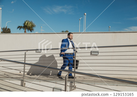 Businessman Leaving The Workplace In The Morning  129153165