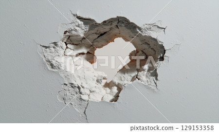 A destroyed wall with a hole in it 129153358