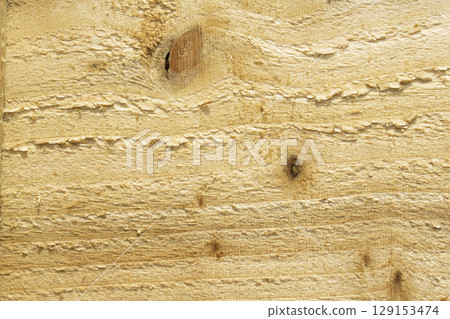 Close up of rough textured raw wood grain for background 129153474