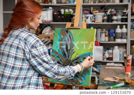 A Creative Artist Skillfully Painting a Beautiful and Colorful Abstract Flower Artwork A Creative Artist Skillfully Painting a Beautiful and Colorful Abstract Flower Artwork 129153870