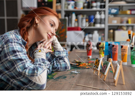 A Creative Artist in Her Studio Deeply Contemplating Various Art Projects and Ideas A Creative Artist in Her Studio Deeply Contemplating Various Art Projects and Ideas 129153892
