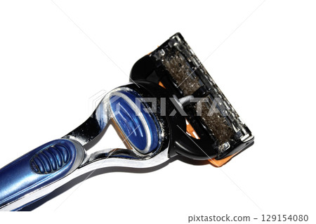 Close up of a used shaving razor on white background 129154080