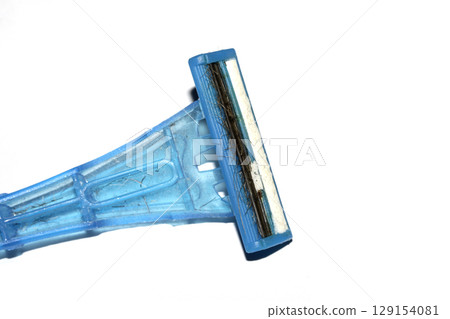 Close up of a used shaving razor on white background 129154081