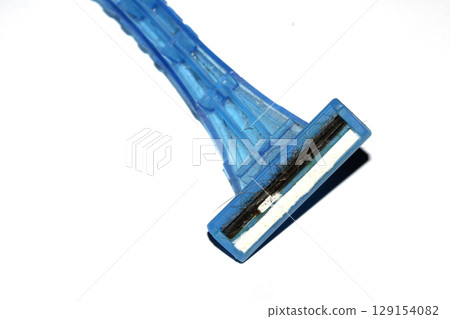 Close up of a used shaving razor on white background 129154082
