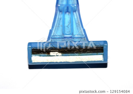 Close up of a used shaving razor on white background Close up of a used shaving razor on white background 129154084