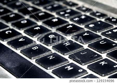 Close up of a laptop heyboard keys  letters and numbers 129154096