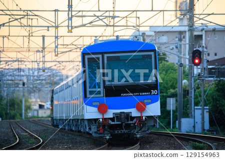Fukuoka City Transportation Bureau 4000 series train (Class A transport) running on the Kagoshima Main Line in the evening Fukuoka City Transportation Bureau 4000 series train (Class A transport) running on the Kagoshima Main Line in the evening 129154963