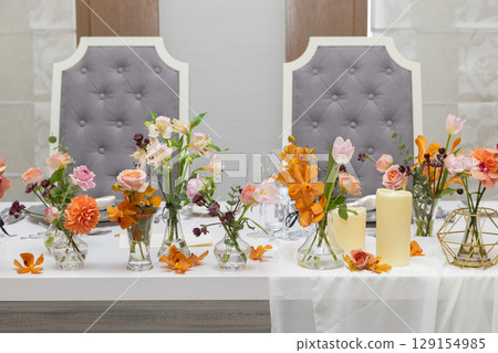 Warm-colored fresh flowers for decorating Takasago and tables 129154985