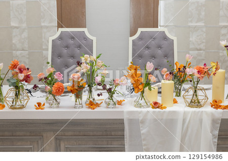 Warm-colored fresh flowers for decorating Takasago and tables 129154986