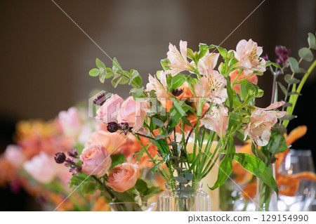 Warm-colored fresh flowers for decorating Takasago and tables 129154990