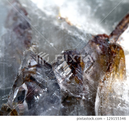 Beautiful close up of quartz crystal rock shard with reflective rainbow spiritual light Beautiful close up of quartz crystal rock shard with reflective rainbow spiritual light 129155346