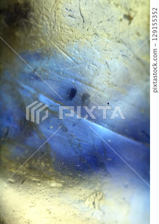 Beautiful close up of quartz crystal rock shard with reflective rainbow spiritual light 129155352