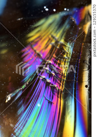 Beautiful close up of quartz crystal rock shard with reflective rainbow Holographic  spiritual light 129155370
