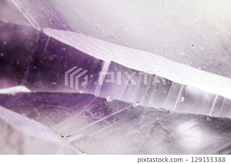 Beautiful close up of quartz crystal rock shard with reflective rainbow spiritual light Beautiful close up of quartz crystal rock shard with reflective rainbow spiritual light 129155388