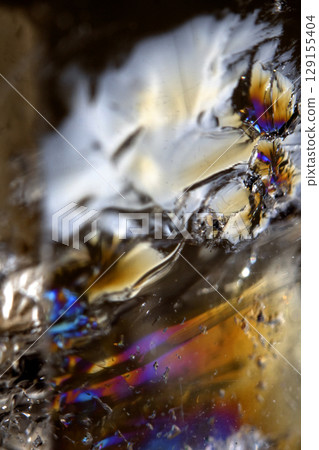 Beautiful close up of quartz crystal rock shard with reflective rainbow spiritual light Beautiful close up of quartz crystal rock shard with reflective rainbow spiritual light 129155404