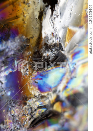 Beautiful close up of quartz crystal rock shard with reflective rainbow spiritual light Beautiful close up of quartz crystal rock shard with reflective rainbow spiritual light 129155405