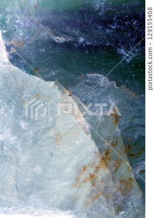 Beautiful close up of quartz crystal rock shard with reflective rainbow spiritual light Beautiful close up of quartz crystal rock shard with reflective rainbow spiritual light 129155408