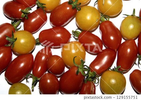 Close up of home grown tomatoes in a bowl waiting to be cooked in a colander 129155751
