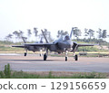 U.S. Air Force F-35A Lightning II stealth fighter jets taxiing in formation on an airport taxiway. 129156659