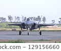 A U.S. Air Force F-35A Lightning II stealth fighter taxis down an airport taxiway. 129156660