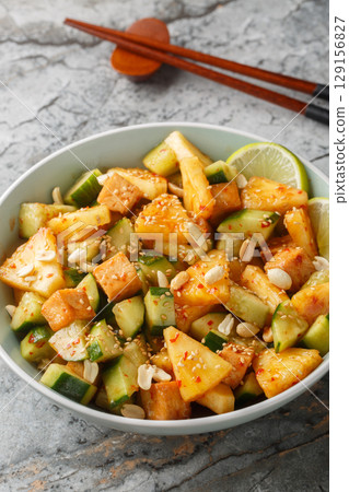Rojak Salad Asian Spicy, Tangy and Sweet closeup in the bowl. Vertical 129156827