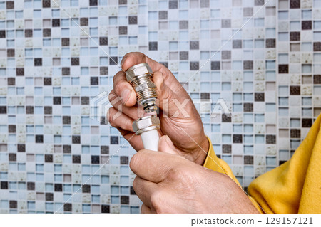 Compression coupling with threaded nut is positioned near end of multilayer pipe for installation to connect segments in household water supply system. 129157121