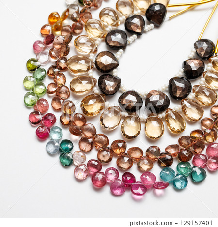 Colorful natural stone beads | Close-up photos of autumn-colored jewelry parts 129157401