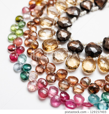 Colorful natural stone beads | Close-up photos of autumn-colored jewelry parts Colorful natural stone beads | Close-up photos of autumn-colored jewelry parts 129157403